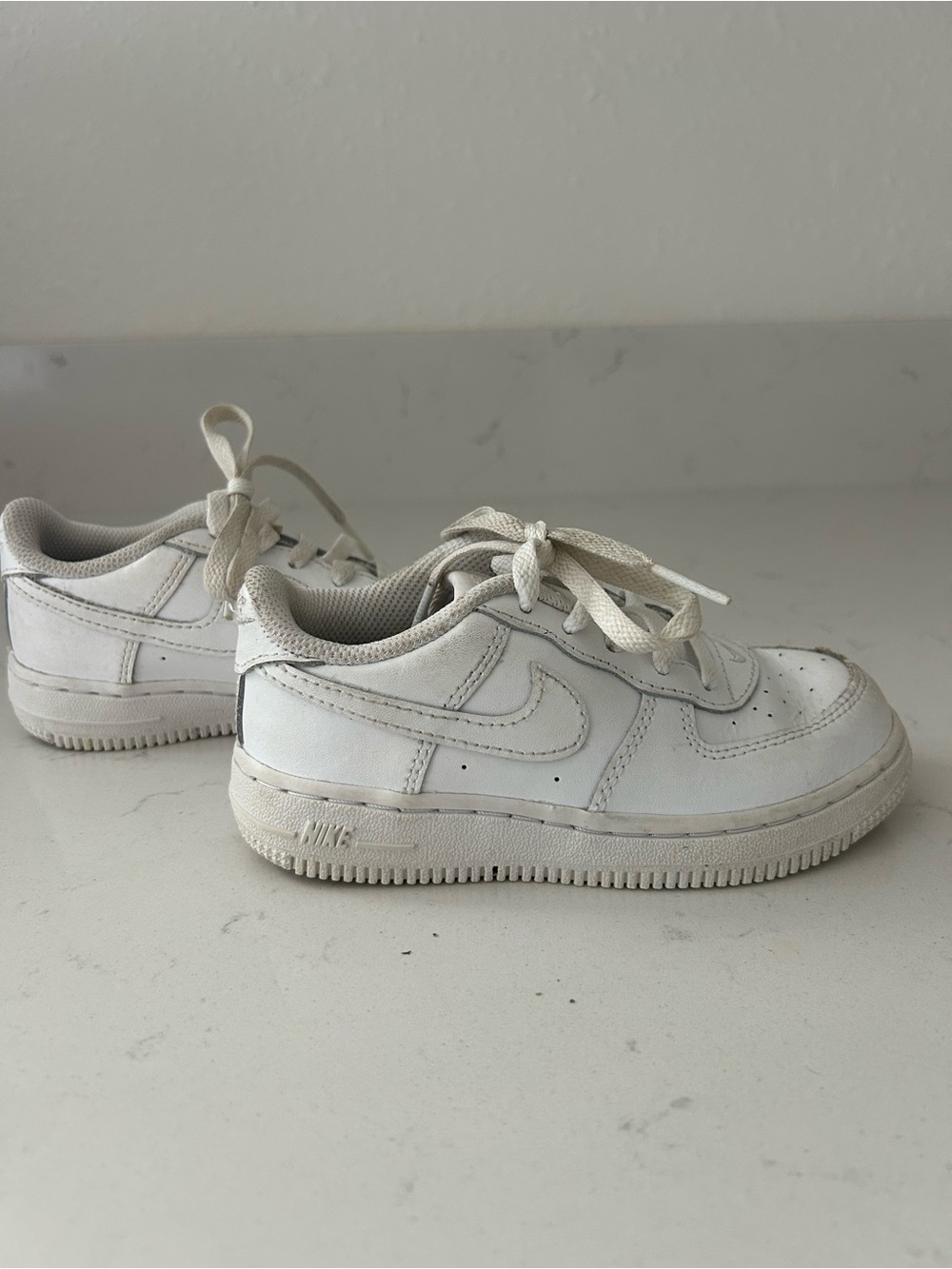 Nike Kids White Low-Top Sneakers with Classic Swoosh